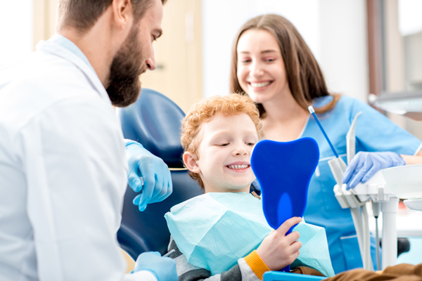 dentist examing child's teeth