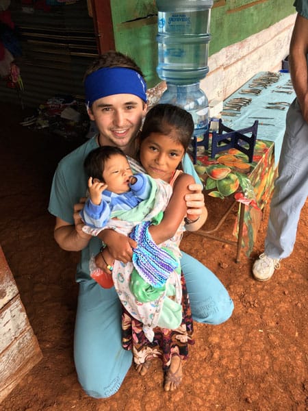doctor with child during humanitarian visit