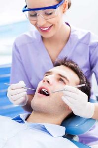 man getting exam for gingivitis